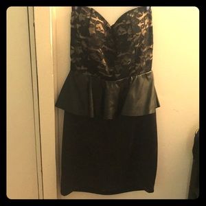 Peplum style dress with bow open back detail